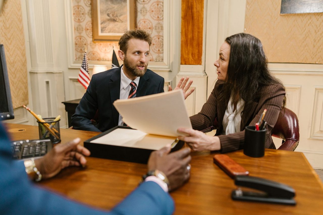 Randy meeting with clients in a conference room